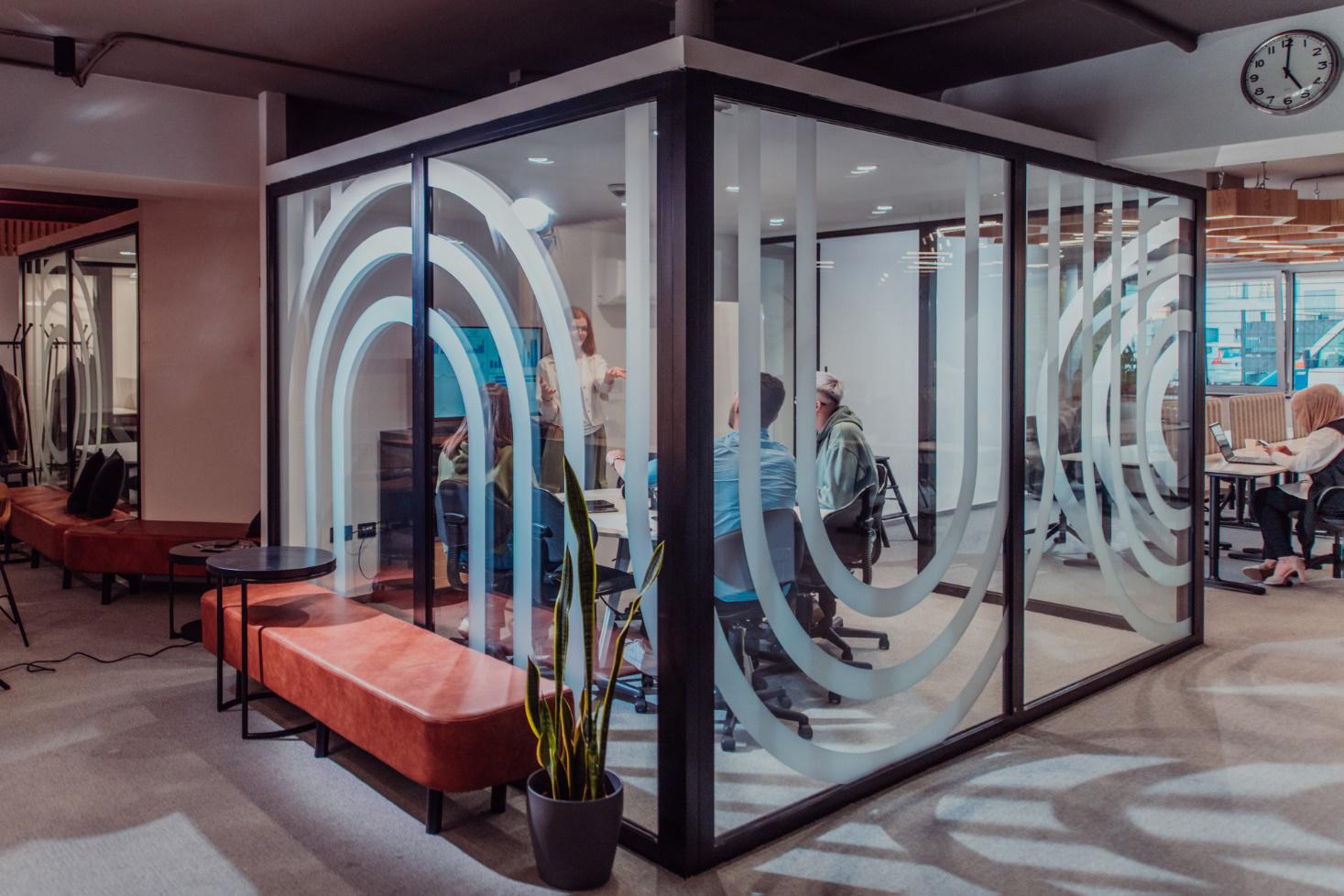 A conference room with printing glass partitions